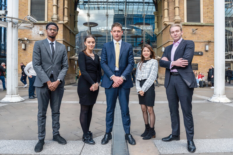 John & Co team photo outside Liverpool Street station