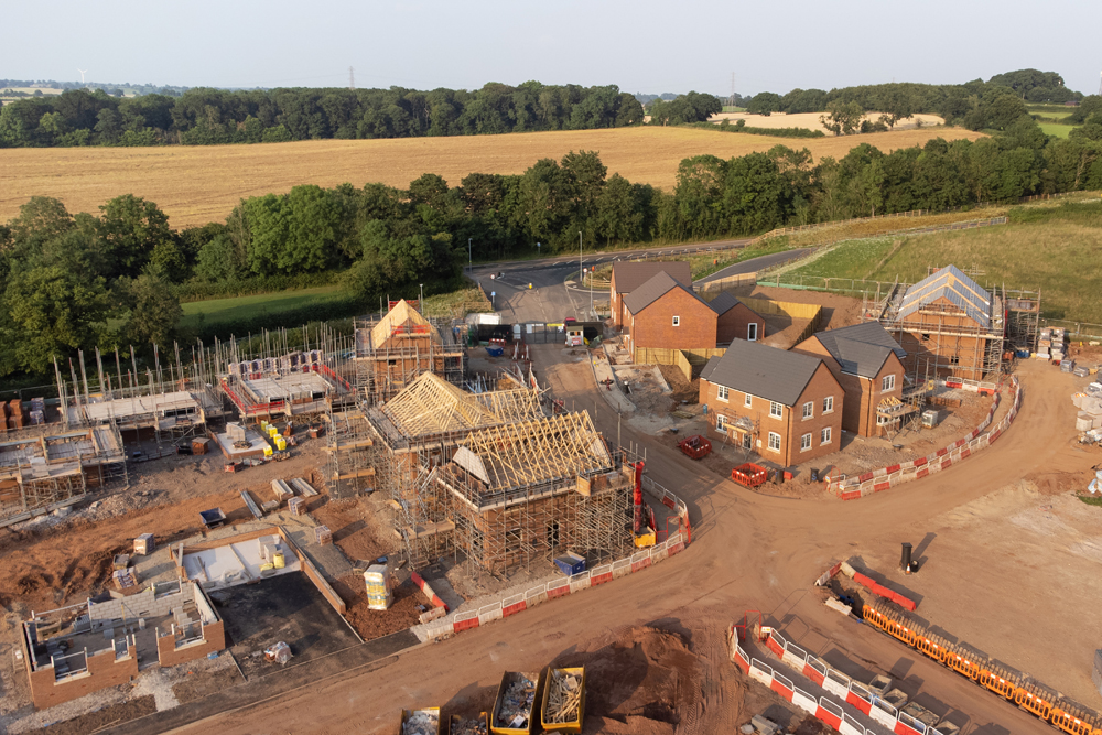 Aerial view looking down on new build housing construction site in England, UK