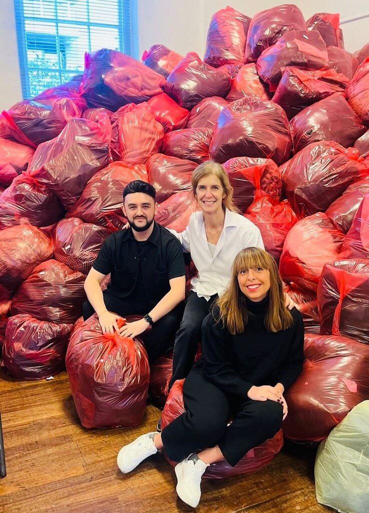 Frances Manthos of Calling London with two members of the Chestertons team sorting coats