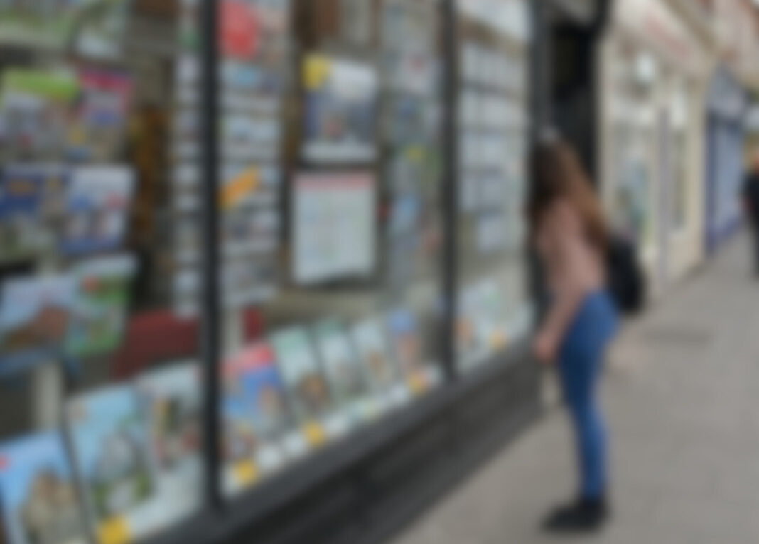 A blurred image of someone looking into an agent window