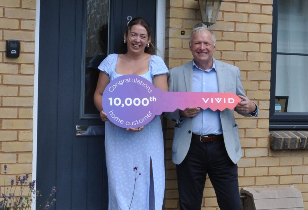 Ashley Shields outside her Vivid home with housing association chief executive Mark Perry.