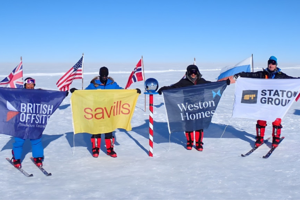 Shaun Weston, South Pole for Charity Expedition, Shaun at The South Pole with flags